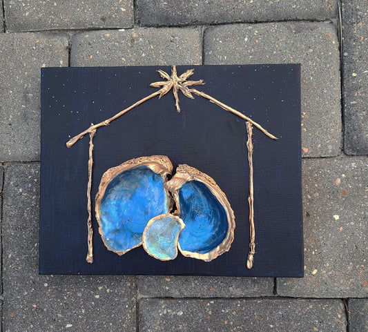 I love the way the oyster shells nestle together. The shells are painted with an iridescent coat and then sprayed with acrylic sealer. The edges are trimmed in Gold. The Manager is painted gold. It is a stark contrast to the dark night full of stars. Approximate size: 8 x 10 x 1 inches