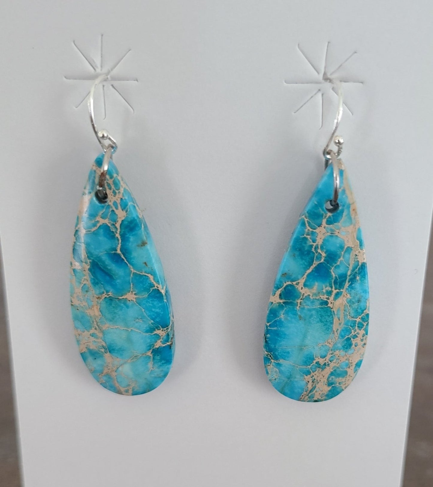 Such interesting matrix in these slab earrings. The label on the card says Blue Indigo, but they are turquoise. Sterling Silver French Hooks. (I replaced the hooks already on the earrings because I was not sure if they were Sterling) Approximate length: 1.75 inches long as they would hang. MSRP: $75