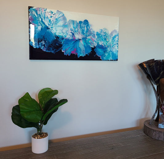 Handcrafted by me in Florida. Three beautiful blooms look like a Morning Glory vine. Theyburst through the canvas in blues, pink, purple, and metallic silver on a black and white background. Acrylic paint with 2 coats of resin on top. Resin is UV rated. Approximately 20 x 10 inches. If you'd like it signed on the back, please leave a message with your order.