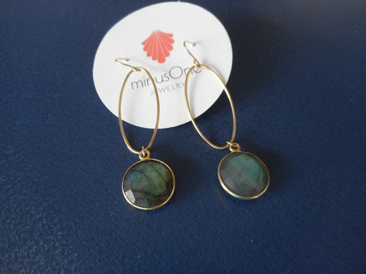 Smoky blue green round stones dangle from thin gold filled (vermeil) ovals. Overall length is approximately 2.5 inches. French hooks.