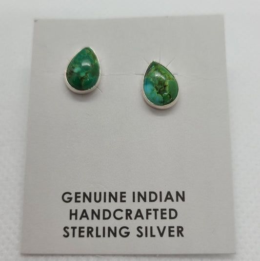 Rich shades of green in this small pair of stud earrings. Sonoran Gold Turquoise set in a simple bezel of Sterling Silver. Sonoran Gold Turquoise is a brand new finding from the Sonora area of Mexico. Sonoran Turquoise actually forms inside clay deposits as individual nuggets. Navajo artist, Dorthy Yazzie Certificate of Authenticity as shown. Stone length is approximately 3/8 inch MSRP: $60