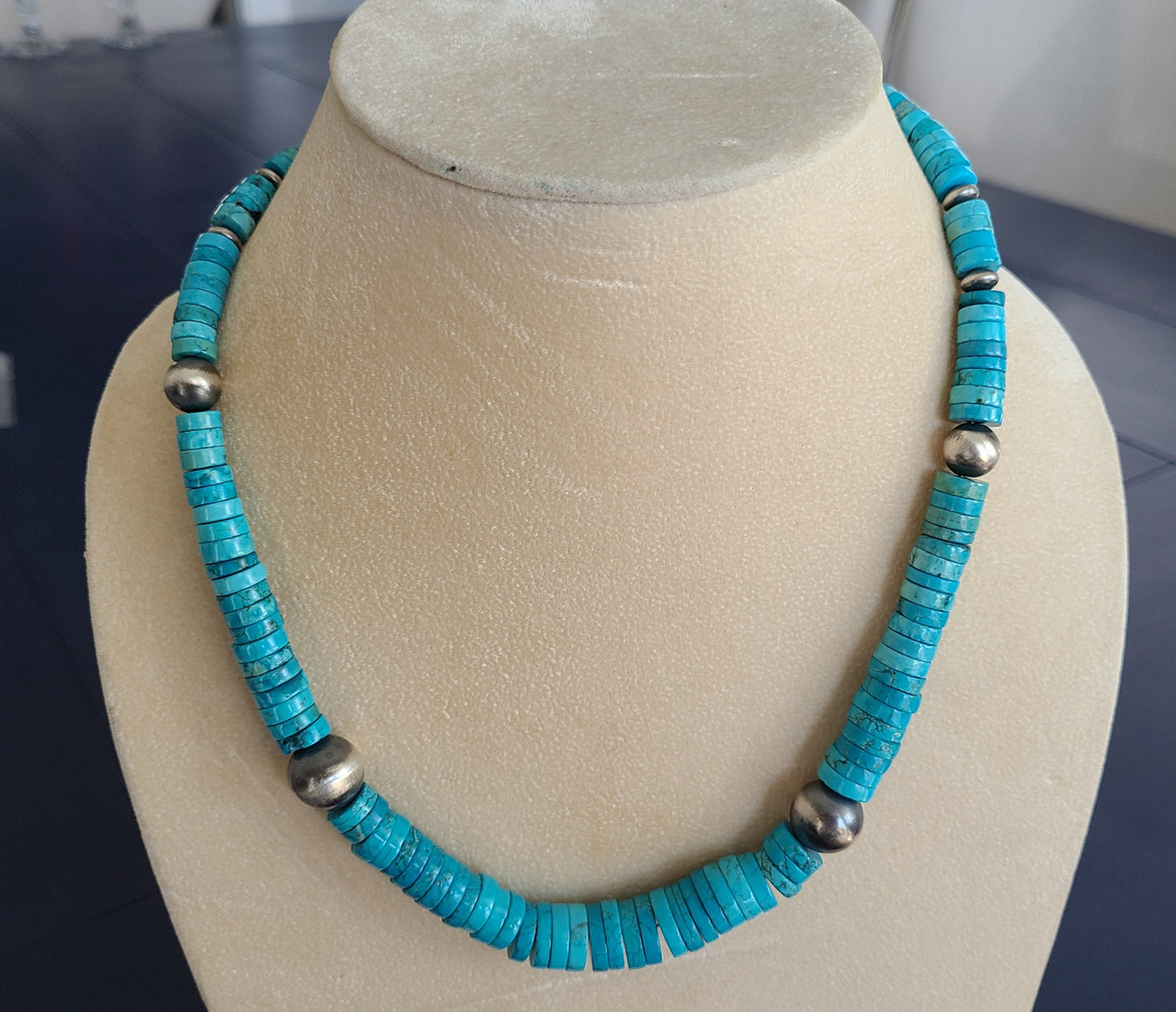 Kingman Turquoise beads are graduated from approximately 3 cm to 12 cm round. Handmade Sterling Silver beads have an oxidized look so that the turquoise really pops bright blue. Lobster Claw closure. Approximately 20 inches long. Navajo Artist, Mason Lee