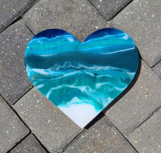 I loved making this heart. Blues and Greens with white waves flow over this heart. The heart is solid wood with resin. Approximate size: 9 x 8.5 x 7.5 inches Saw tooth hanger on the back.