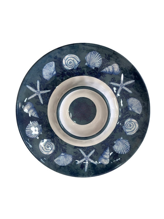14 inch round melamine chip and dip server. Molded bowl in the middle. Dark blue and white. Shells, starfish and a compass create the nautical theme.