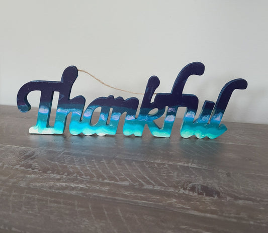 I just created this little piece of relaxation and am "Thankful" it came out like it did! The colors of the ocean are done in Acrylic paint and it has three coats of varnish on it. Can be hung or you can cut off the rope if you want to let it sit on a shelf Made of MDF or dense cardboard, not sure which Approximate size: 16 L; 5.5 H; .5 D