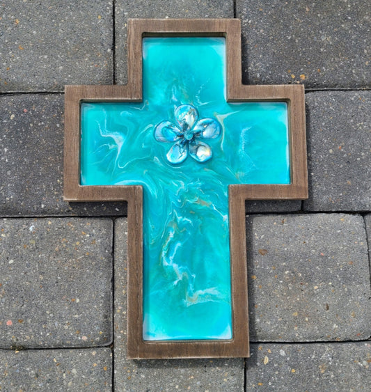 Beautiful Turquoise, teal and white with a small amount of gold in this beautiful cross. The colors really sparkle! Resin In the Center, I placed abalone shells and a acrylic "diamond" Wood MDF cross with saw tooth hanger on the back Approximate size: 14.25 x 10 inches