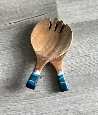 How cute these are!

Set of two

Wood servers have an ocean theme resin on the handle.

Approximate size: 9.75 inches long.

Care: not dishwasher safe. Hand wash only. Occasionally condition the wood with vegetable or olive oil.