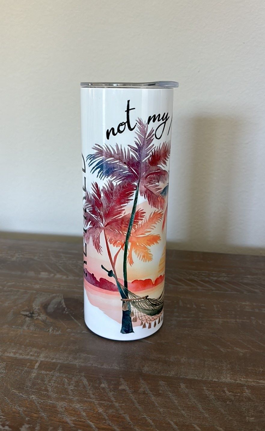 Retired? This is the perfect cup for you. It reads “retired not my problem anymore”
White cup has beautiful sunset picture with palm trees, and hammock.
20 oz stainless steel will keep your drink cold or hot for hours.
Comes with plastic lid.
Hand wash only. Do NOT microwave. Food safe.