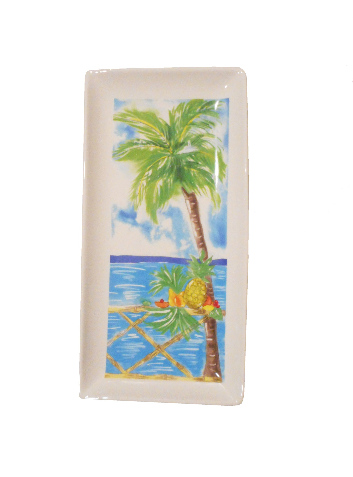 14 x 7 Ceramic Tray features an ocean view with a palm tree in the foreground and a table with tropical fruit.