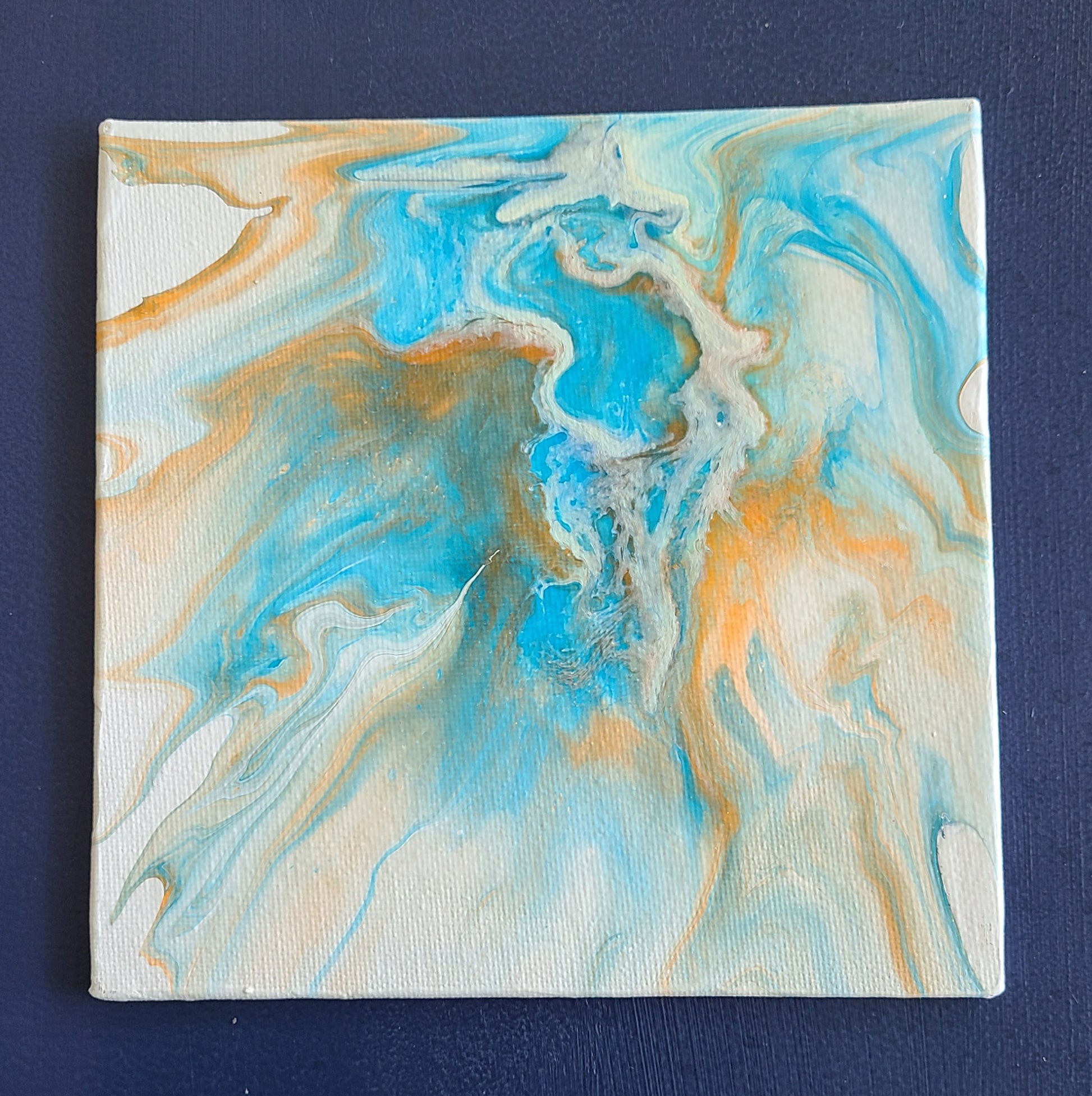 What do you see in this one?  An Angel? Water flowing through a canyon?  That's what I see, hence the name.  Many people thought they saw an angel. Whatever you see, I hope you like it.    Acrylic pour on a 6x6 Inch art panel.  Comes with the easel shown, a gold twisted wire for tabletop use or you can frame it to hang on the wall.  If you want it signed on the back, leave a message.