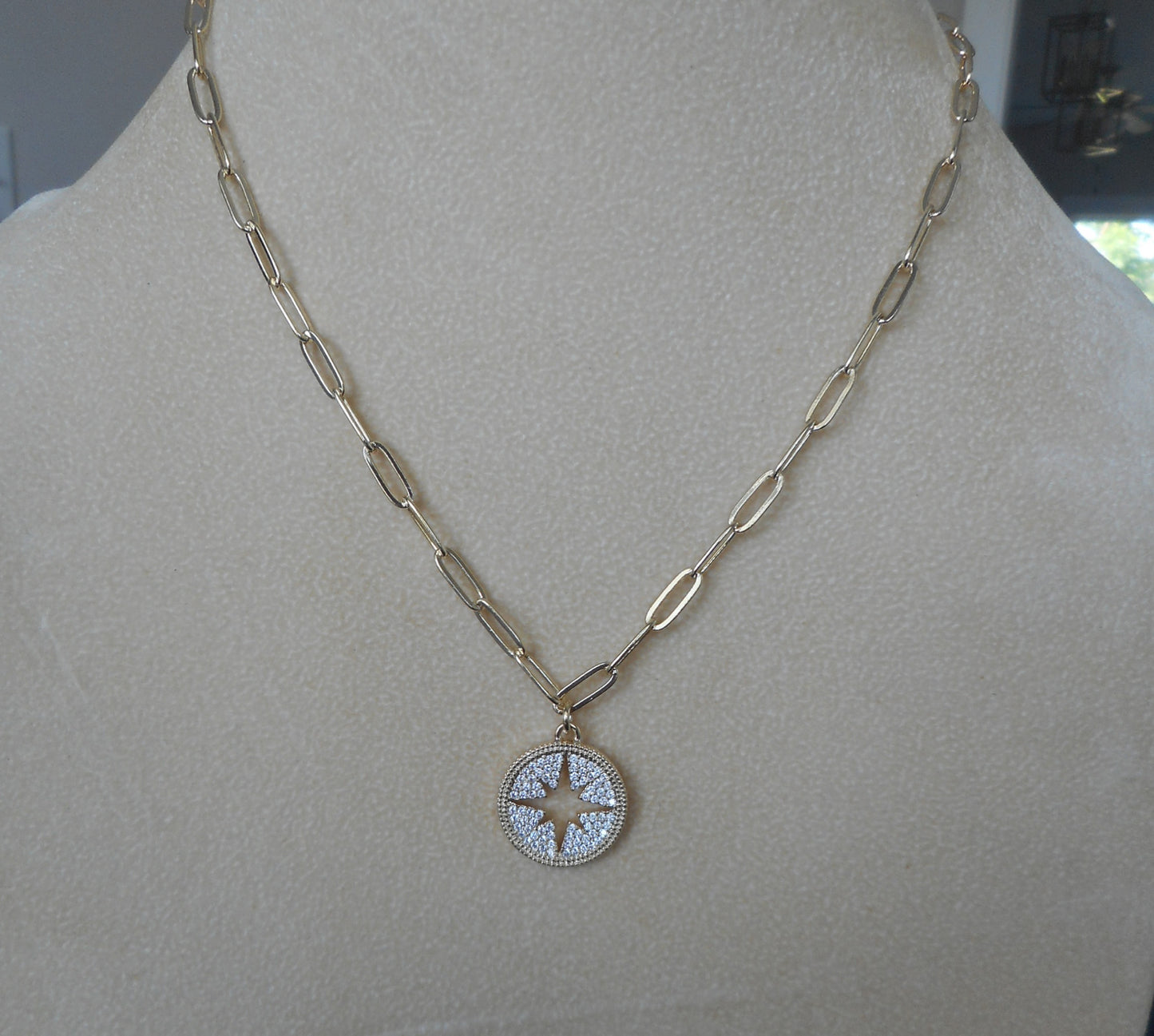 Gold tone link necklace with Compass Rose with Pave CZs. Overall length is 18 inches with 2 additional inches on the extender. Fashion jewelry that looks like the real thing!