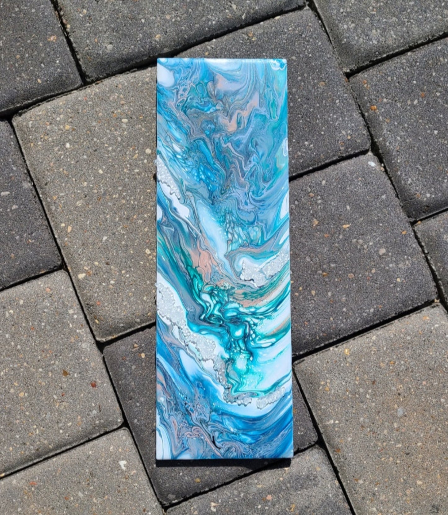 I did this little piece on a 13 x 4.25 inch tile. Rushing River along crystal "ice" in Beautiful teal, blues, rust and white. I used pigments for my colors, so they have a bit of shine to them. Cork backing and a picture hanger on the back.