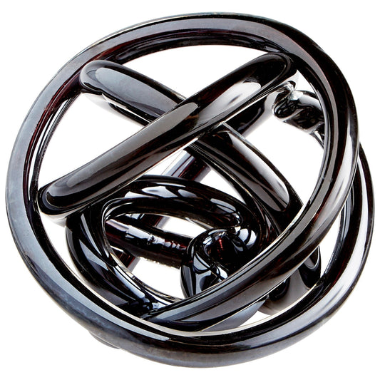 Glass knot approximate 3 x 3 inches. Sometimes it looks black, sometimes a blueish color. Iridescent color that changes from every angle.