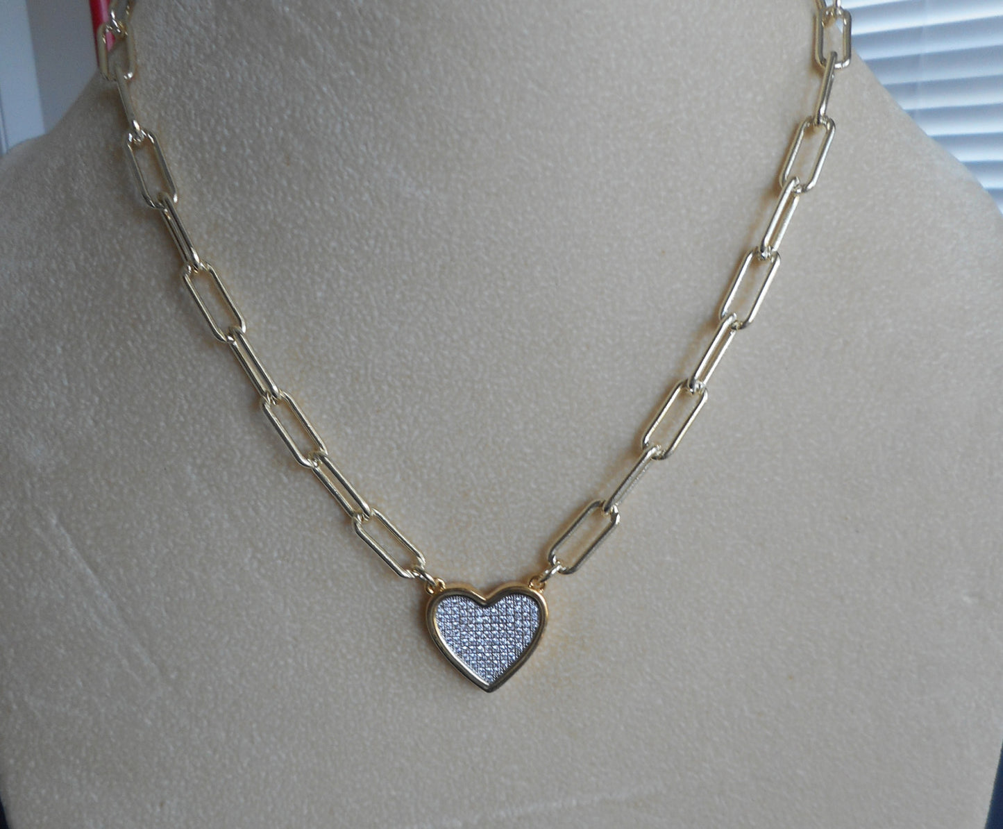 Gold toned link necklace with heart.  Pave' CZs.  18 inches plus 2 on extender.