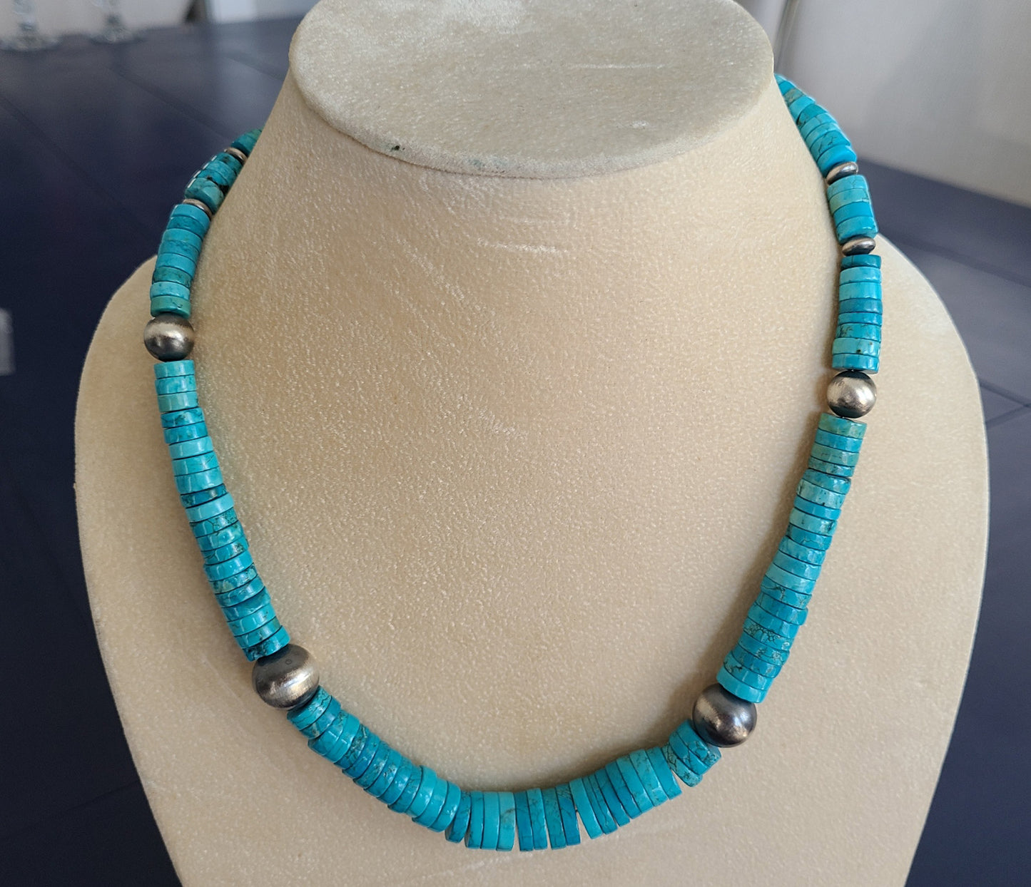 Kingman Turquoise beads are graduated from approximately 3 cm to 12 cm round.  Handmade Sterling Silver beads have an oxidized look so that the turquoise really pops bright blue. Lobster Claw closure. Approximately 20 inches long. Navajo Artist, Mason Lee