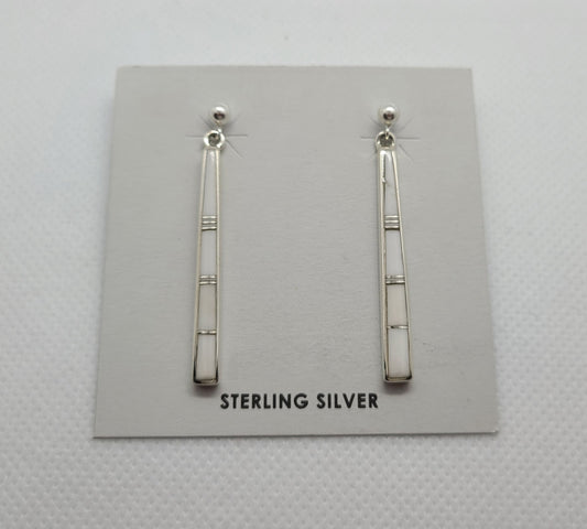 These earrings are stick like, White Buffalo stone inlaid in Sterling Silver with small slivers of silver between the stones.  Mostly pure white with a very small amount of matrix. Approximately 1.5 inches long. Navajo artist Rick Tolino. Comes with Certificate of Authenticity.