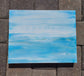 I call this painting Tranquility because it makes me feel so calm when I look at it.  Calm Seas and Blue Skies. Thick Canvas Can easily hang or sit on a shelf Approximate size: 14 x 11 x 1.5